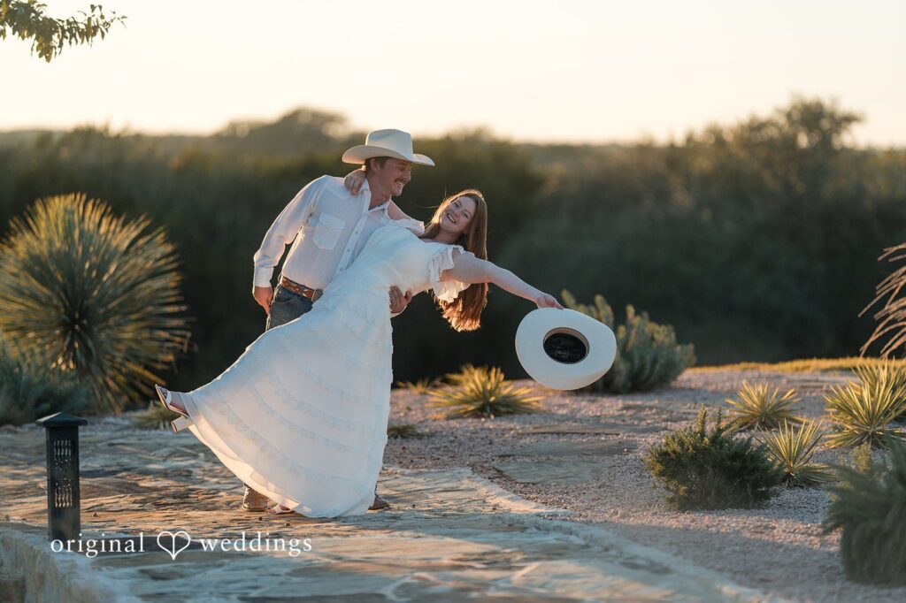 The bride twirls joyfully while her partner watches with admiration, a moment perfectly captured by austin wedding photographers.