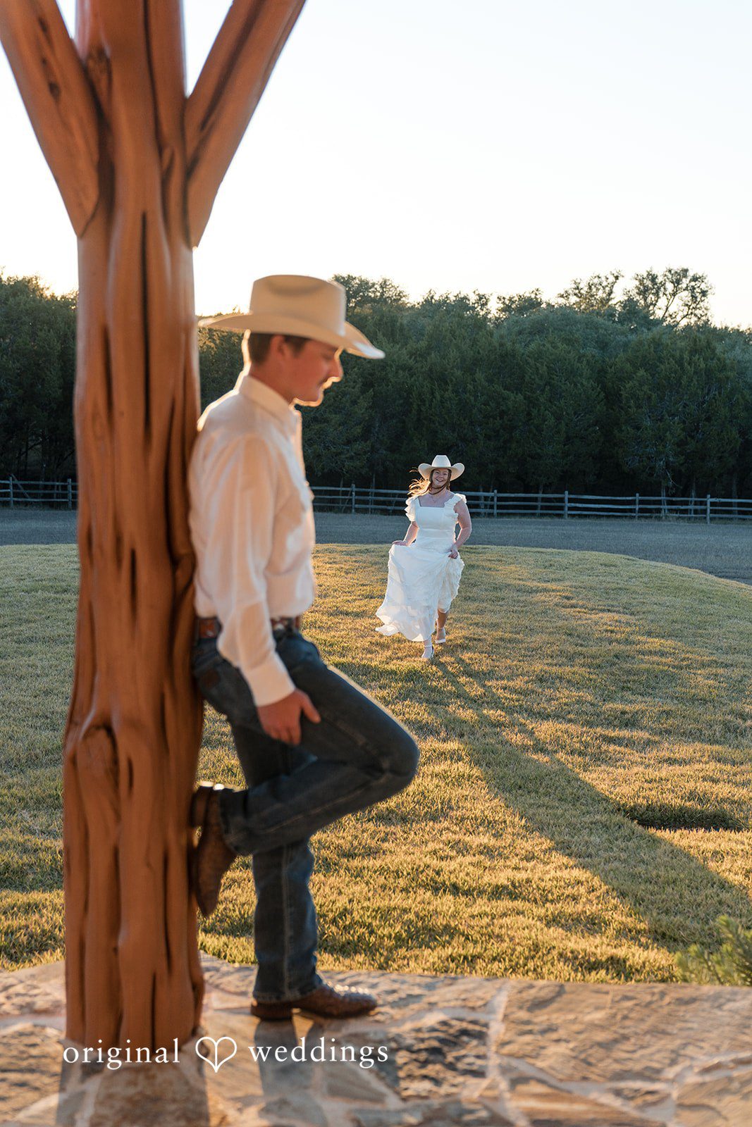 Walking hand in hand, they enjoy the warmth of the setting sun.