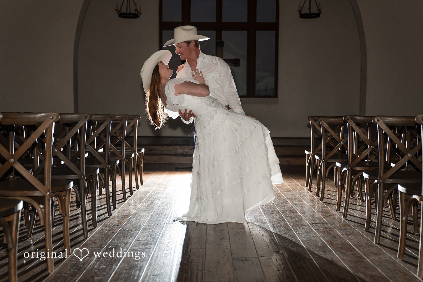The bride stands alone in a beautiful corridor, radiating calm confidence.