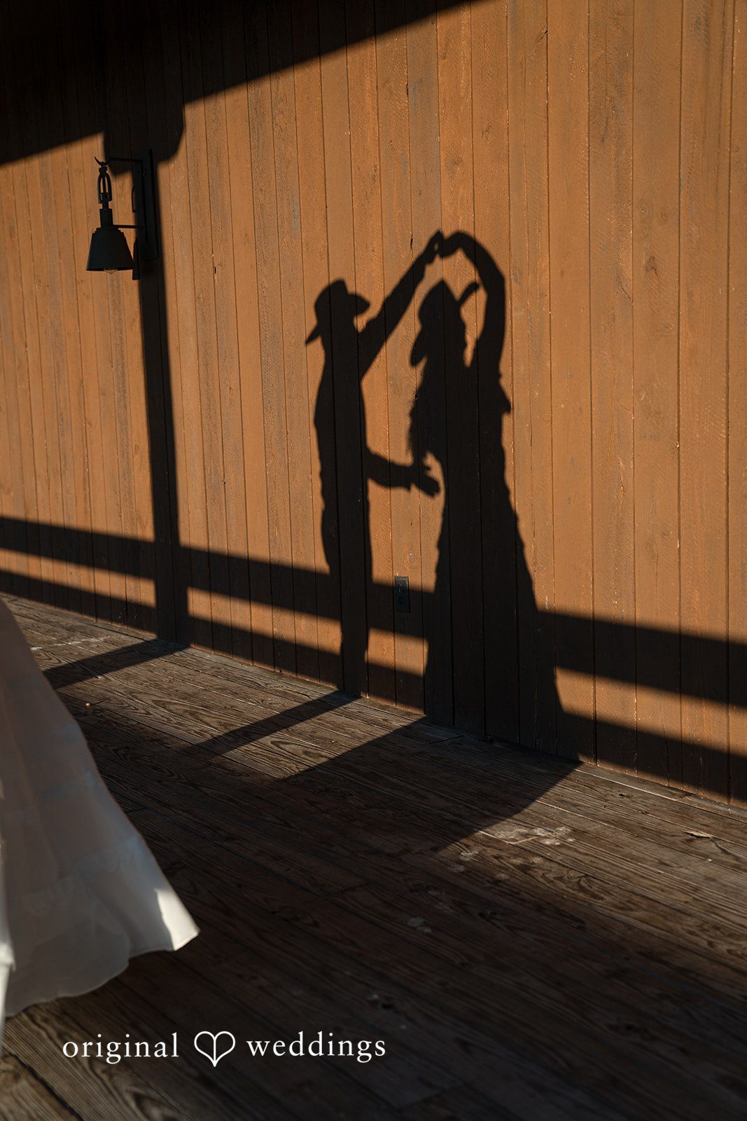 Their silhouettes form a heartwarming scene against a glowing backdrop.