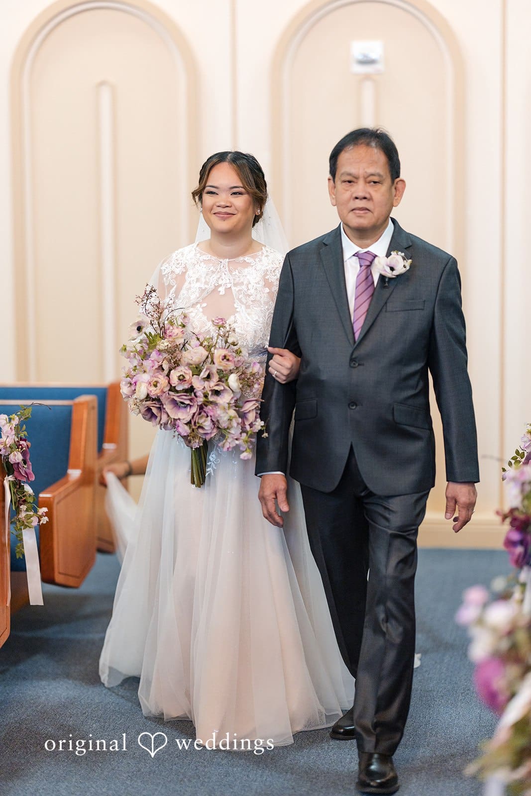 Bride walking hands in hands with her companion.