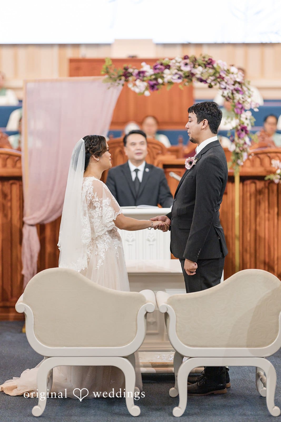 Bride and groom exchanging vows during the wedding ceremony.