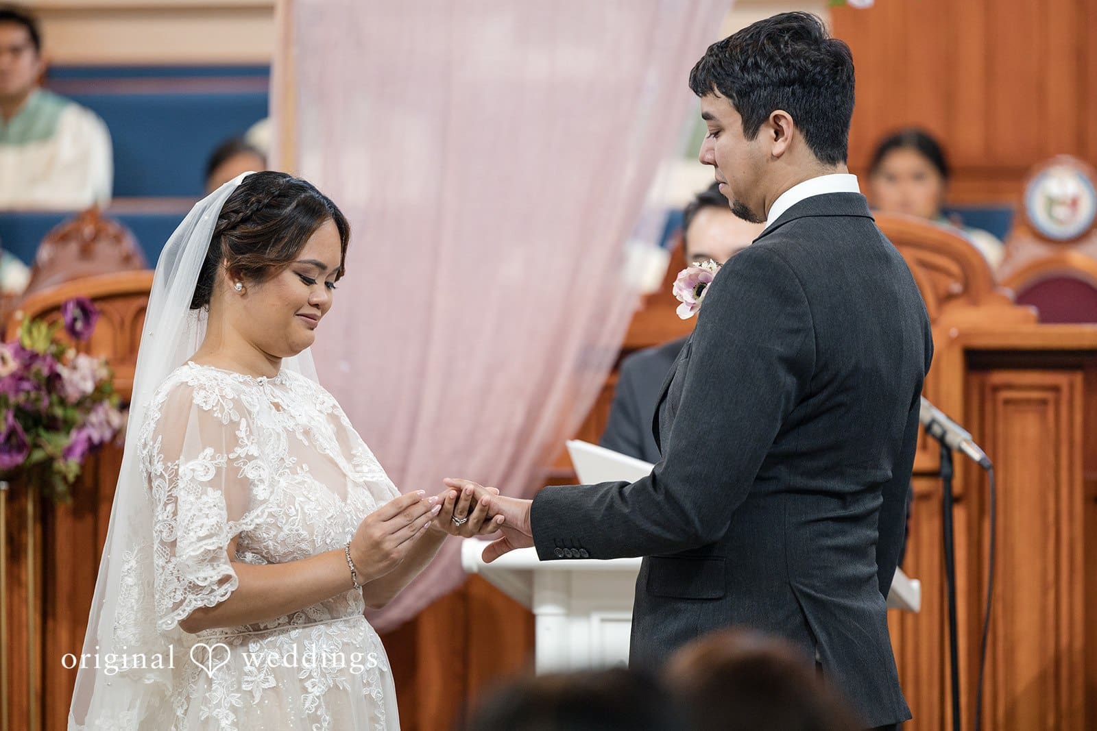 Couple exchanging rings at Iglesia Ni Cristo