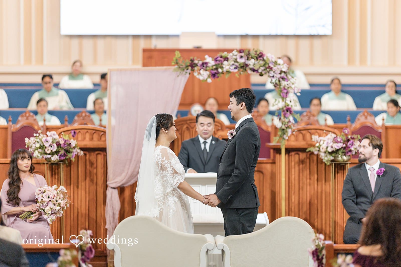 Bride and groom exchanging vows during the wedding ceremony.