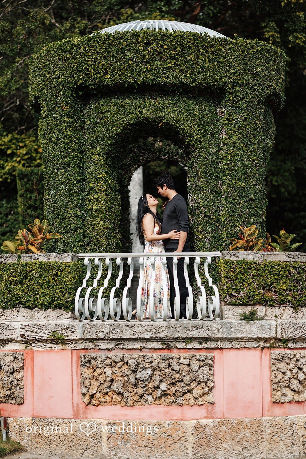 Kristian + Fernando Loving couple sharing a gaze while posing at Vizcaya Museum & Gardens