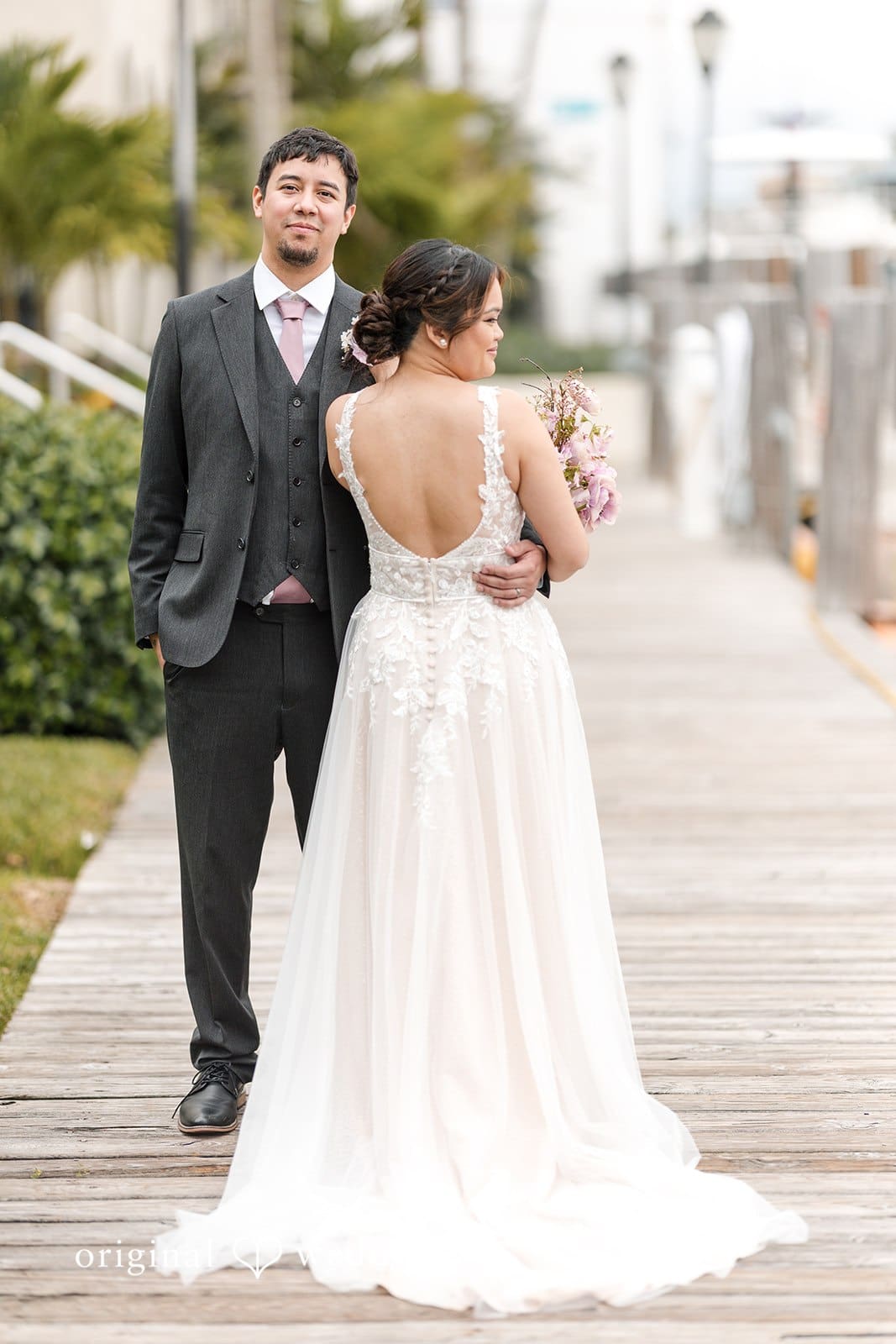 Bride & groom posing together at Iglesia Ni Cristo