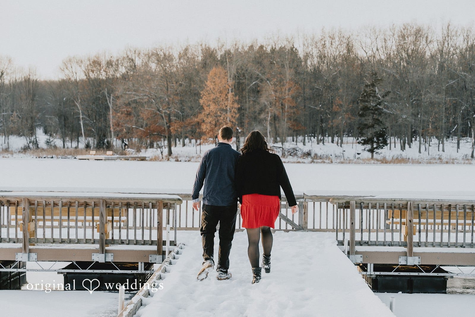 A back-view portrait of the couple taking a walk