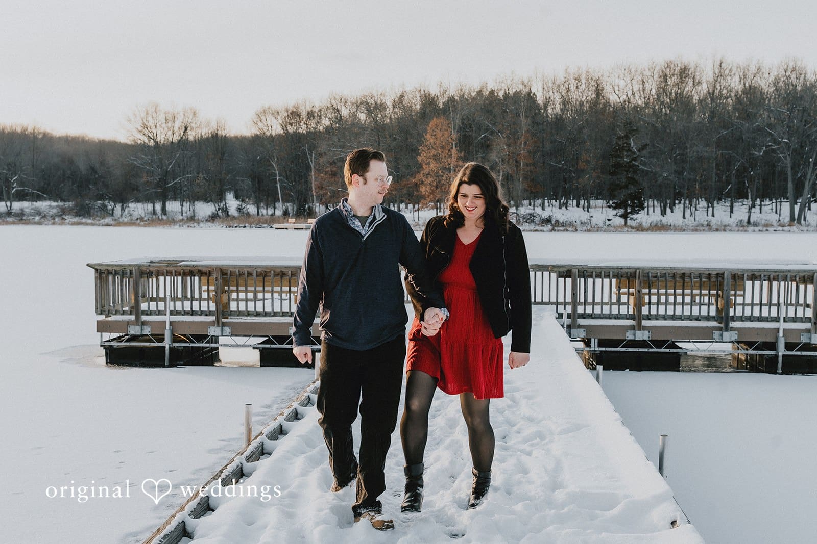 The couple takes a walk through the snow