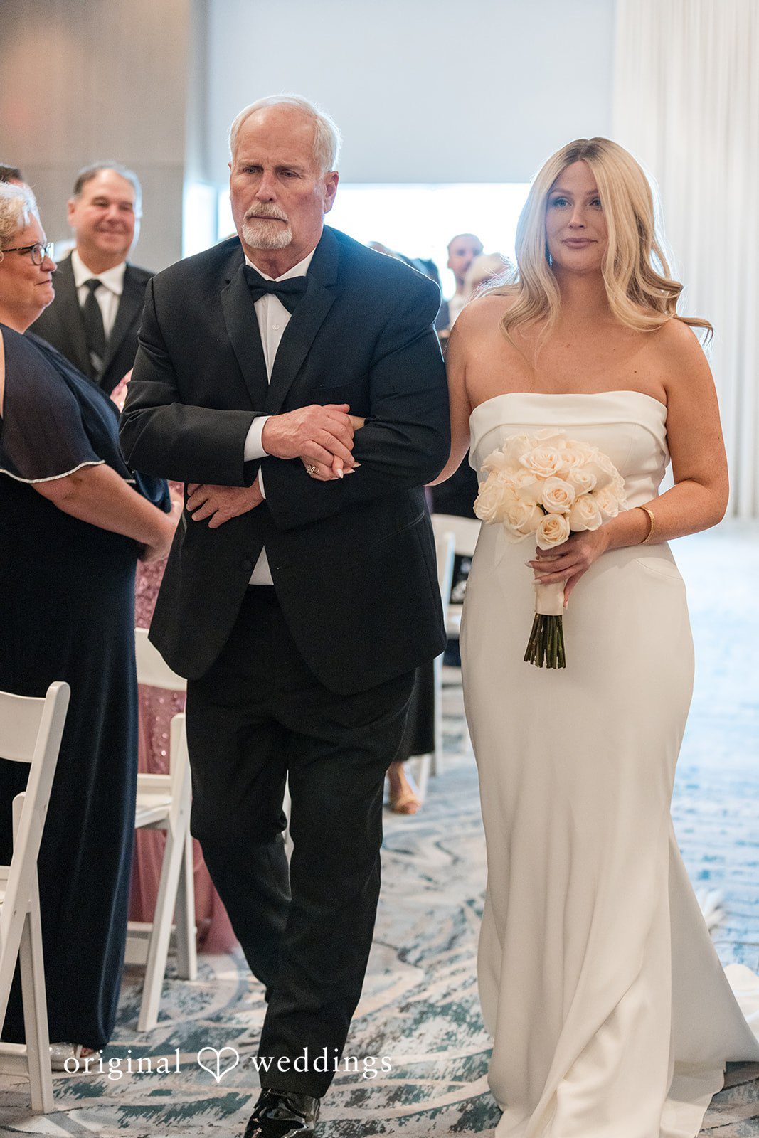Bride walking down the aisle at JW Marriott Clearwater Beach Resort.