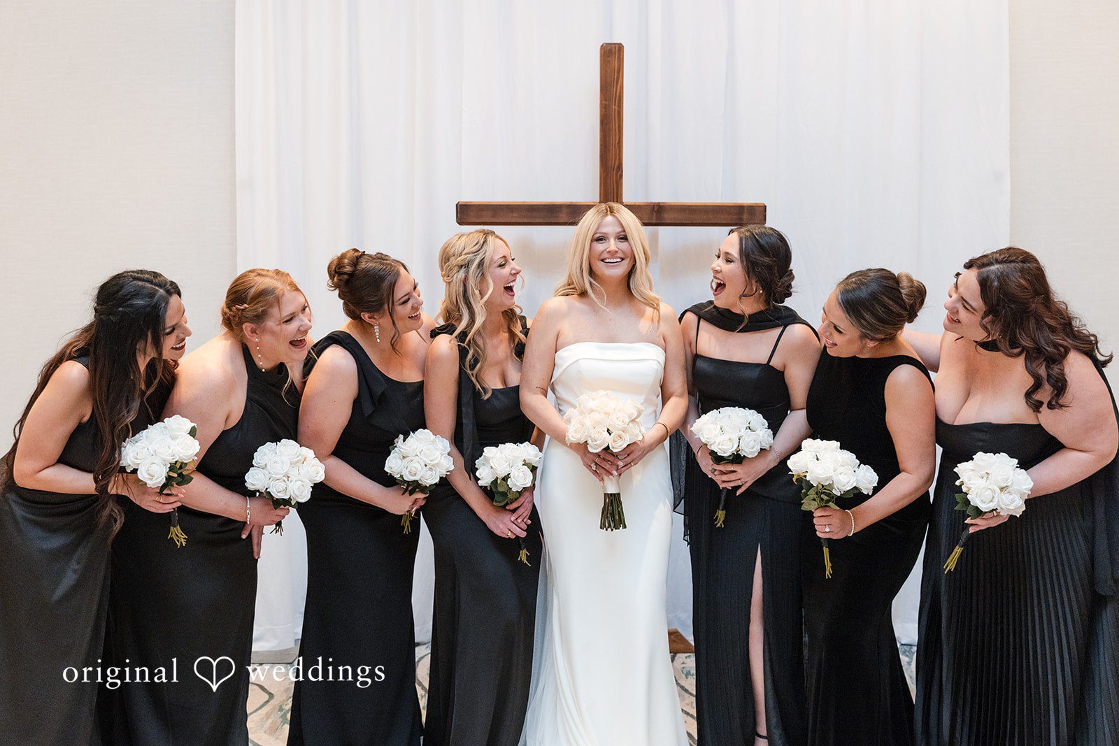 Bride with bridesmaids holding bouquets at JW Marriott Clearwater Beach Resort.