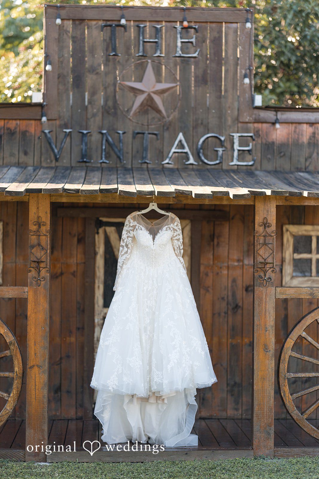 Close-up of bridal dress hanging before ceremony at Lovely Barn