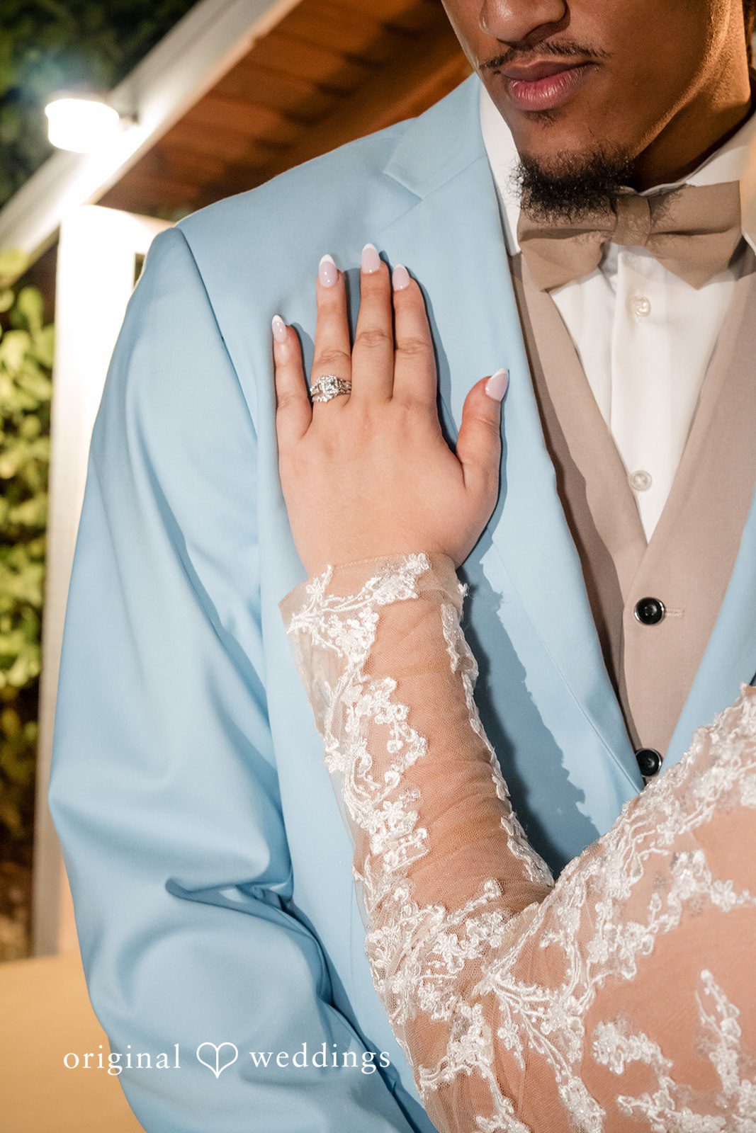 Miami Wedding Photographer capturing bride placing hand with ring on groom’s chest at Lovely Barn by Original Weddings