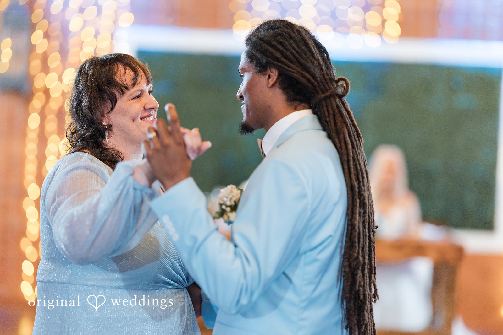 Elegant wedding portrait of groom dancing at Lovely Barn