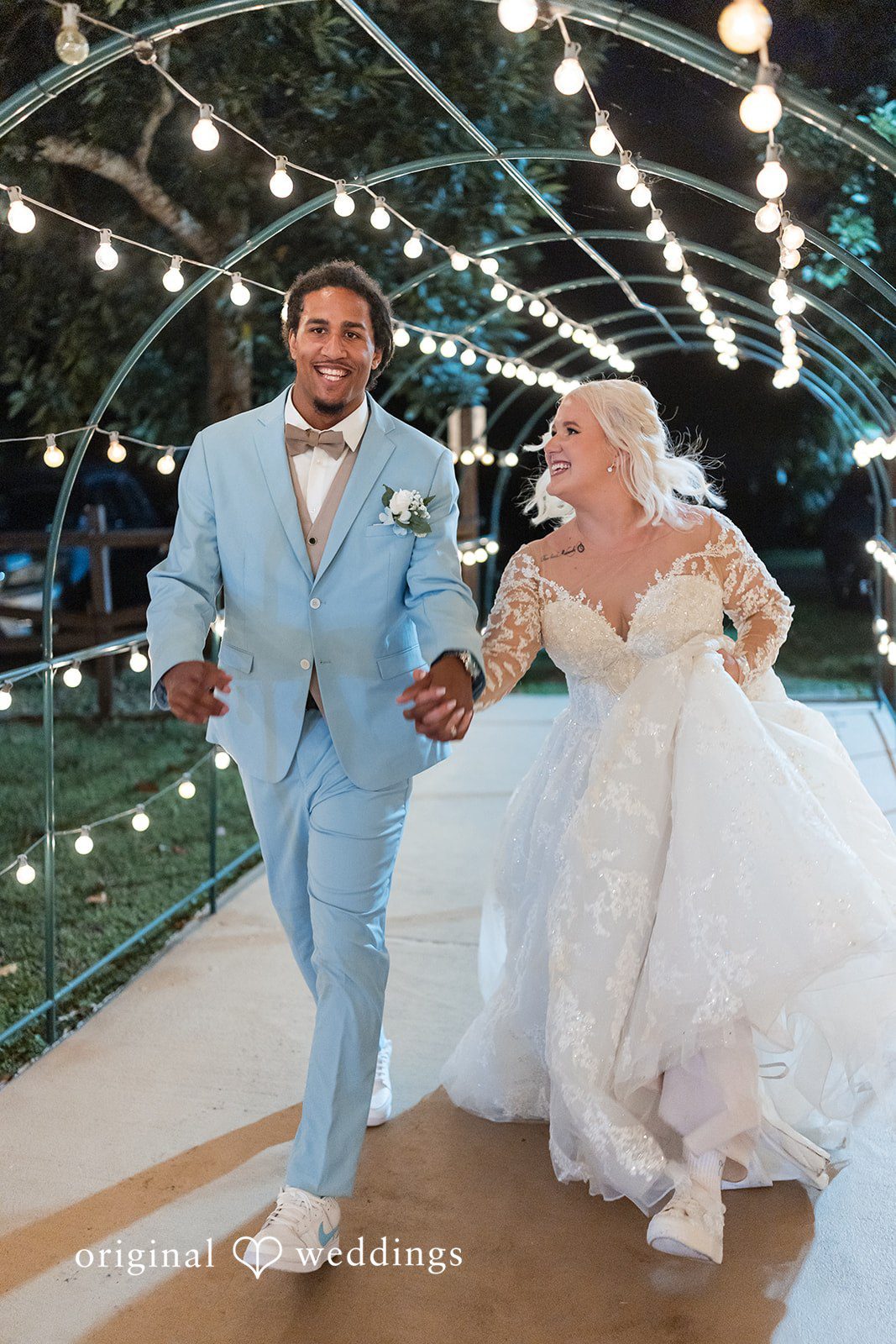 Couple entering together for their wedding celebration