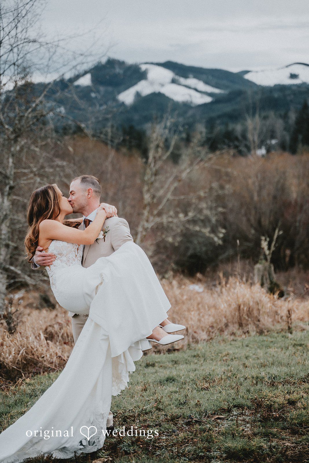 Kelsey + Adam Groom lifting bride captured by Seattle wedding photographer from original weddings.