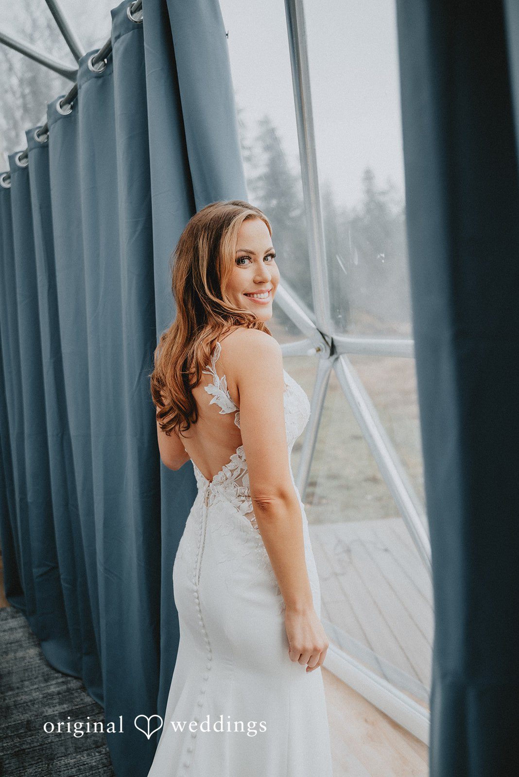 Kelsey + Adam Bride posing in a wedding dress.