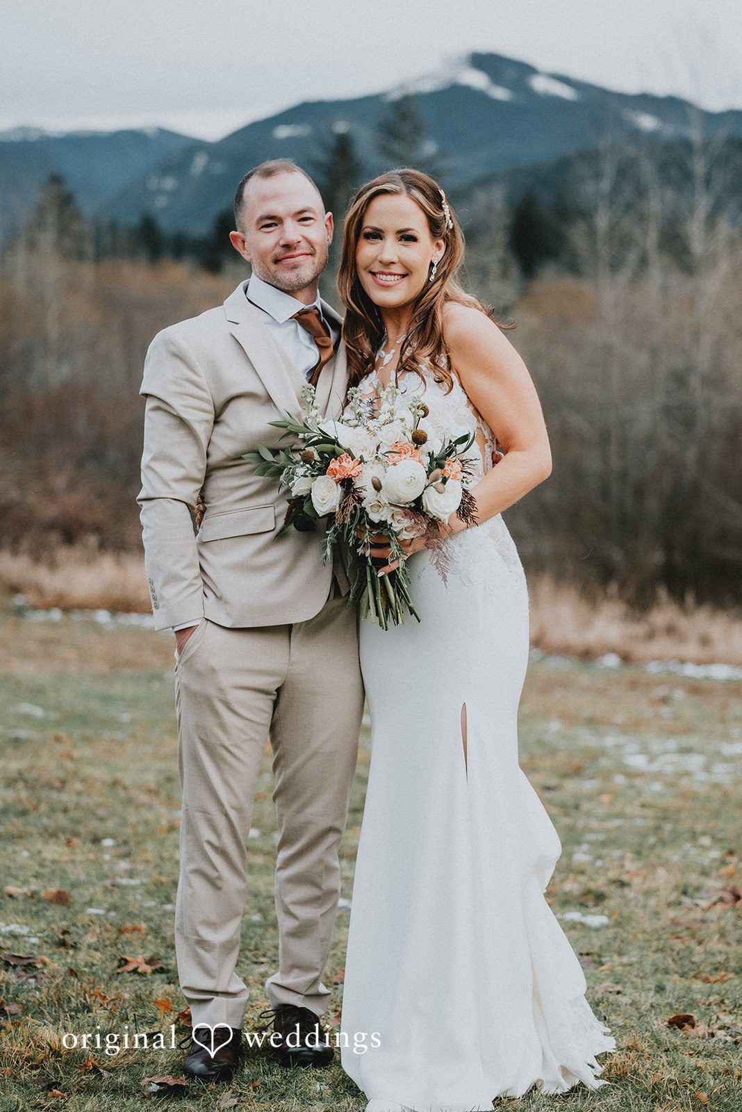 Kelsey + Adam Couple posing with bouquet.