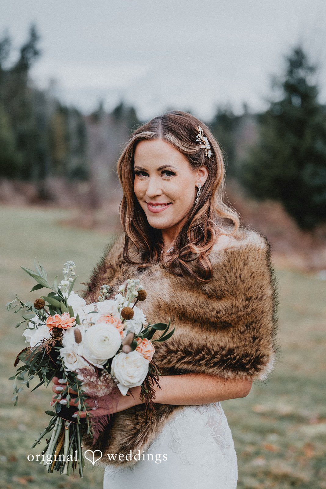 Kelsey + Adam Bride smiling with bouquet wearing a fur wrap.