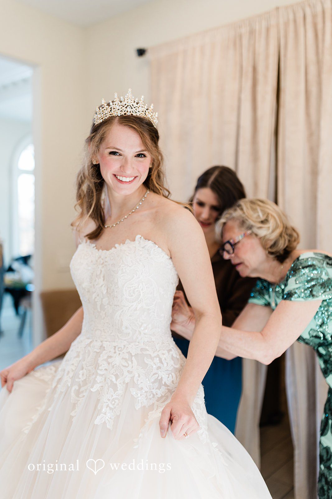 Celine + Cassin Bride preparing for wedding with final dress adjustments.