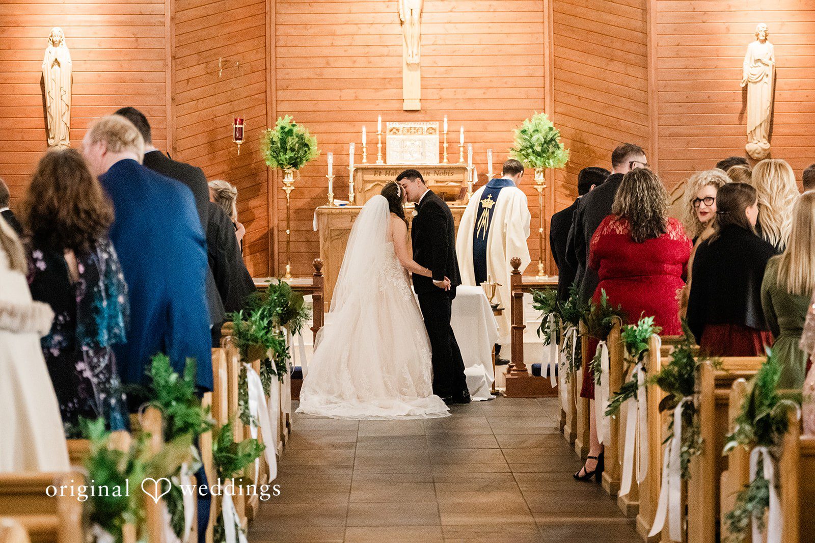 Celine + Cassin Bride and groom kissing at wedding ceremony..