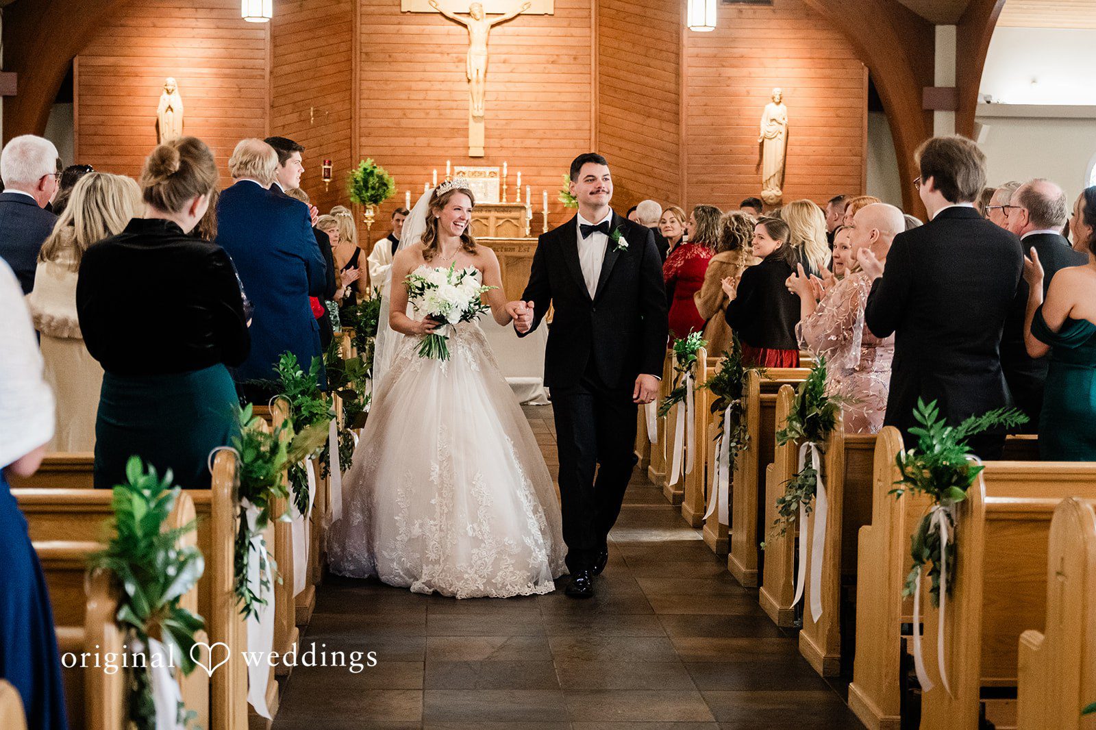 Celine + Cassin Couple holding hands after the ceremony end.