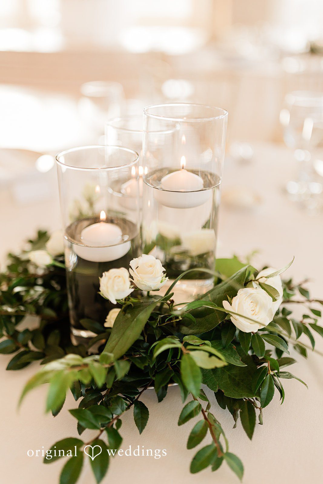 Celine + Cassin Wedding table adorned with floral arrangements and decor.