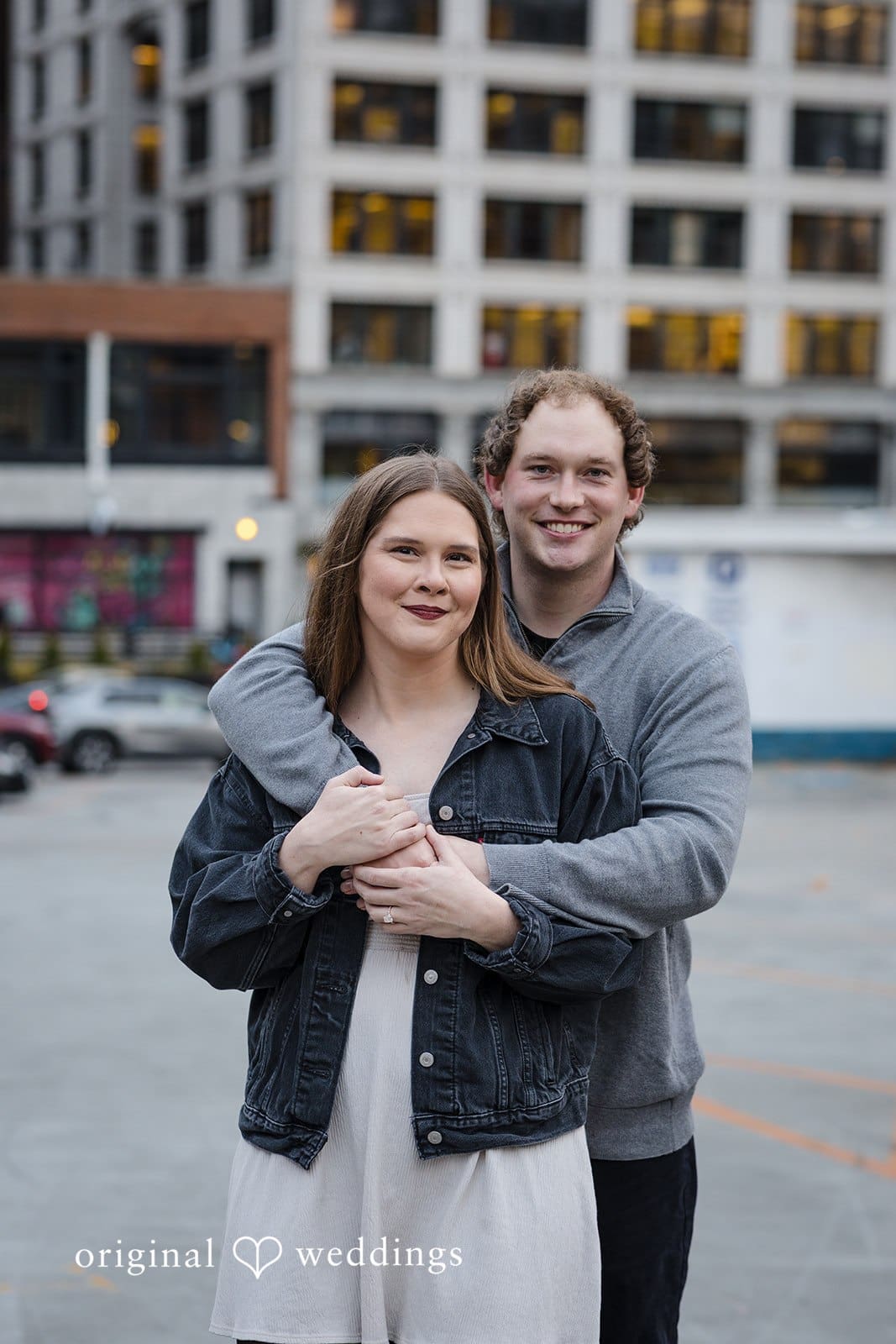 Hailey + William A romantic portrait of the couple holding each other at Pioneer Square