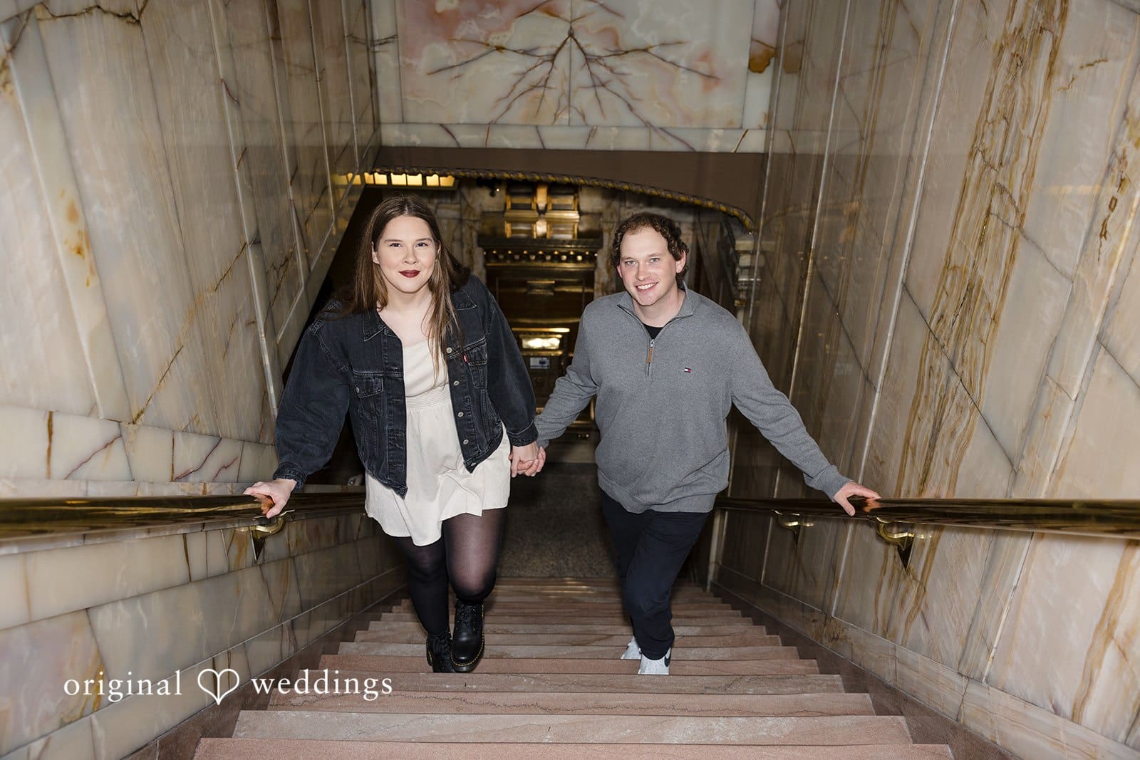 Hailey + William A portrait of the couple walking up the stairs at Pioneer Square