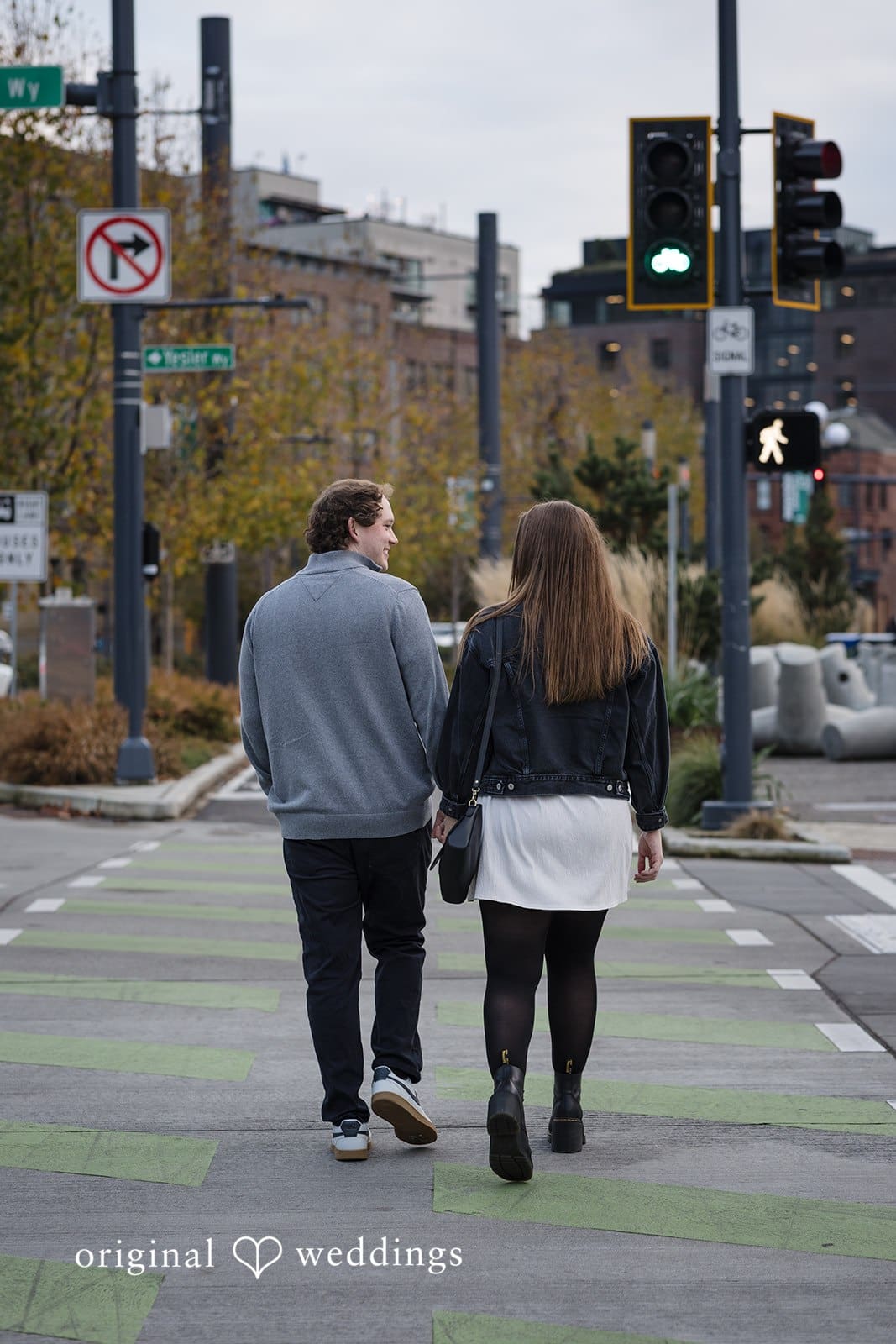 Hailey + William A shot of the couple taking a walk in Pioneer Square