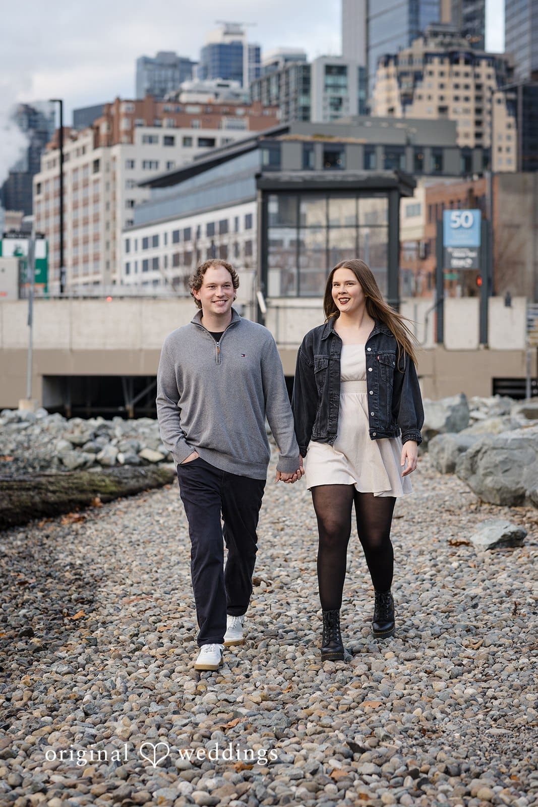 Hailey + William A portrait of the couple taking a walk through the rocky path in Pioneer Square