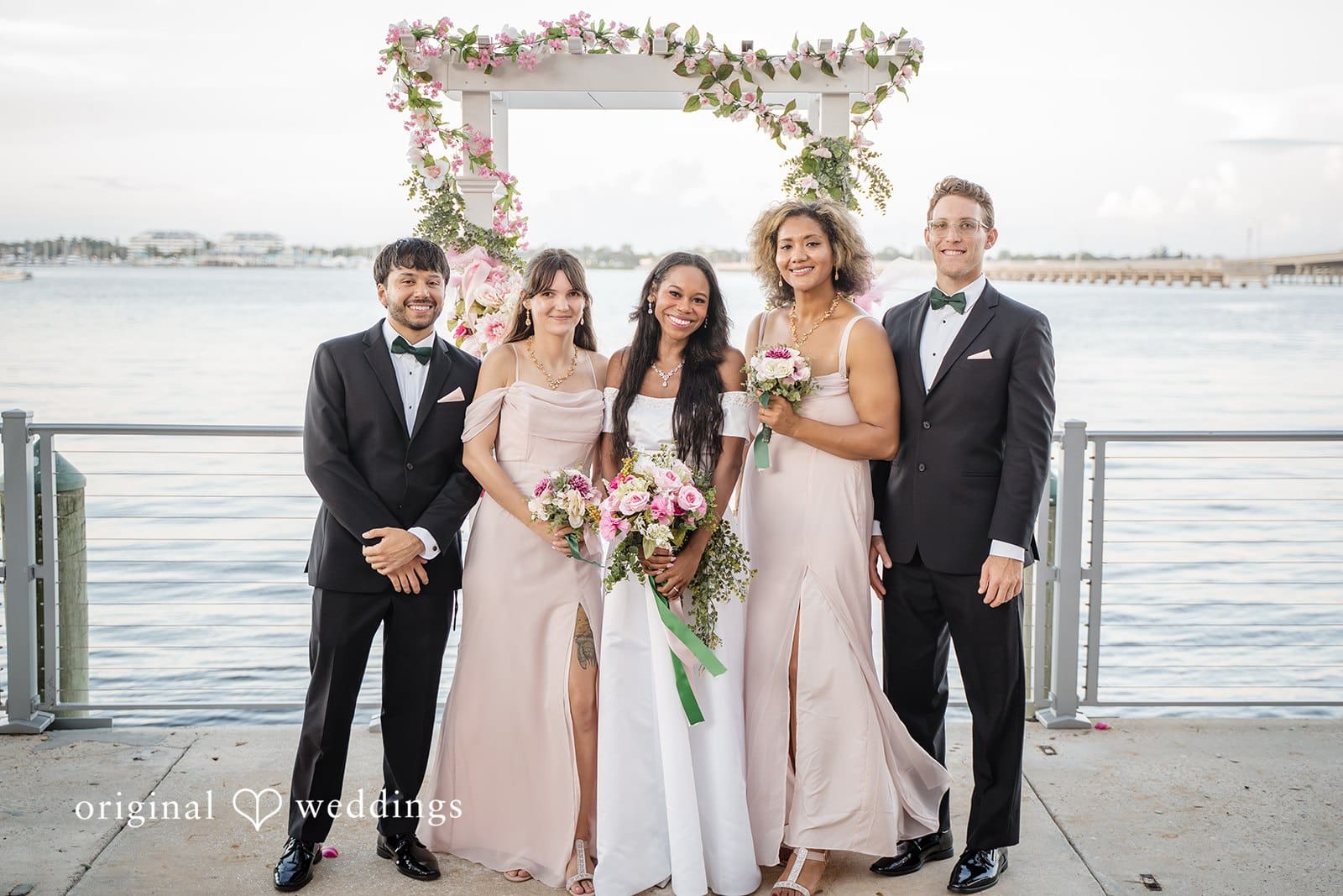 The bride and groom pose with their close friends.