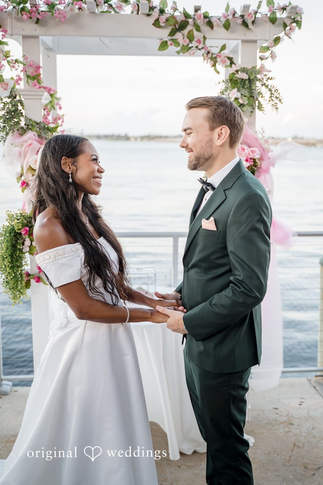 The couple share loving glances with each other.