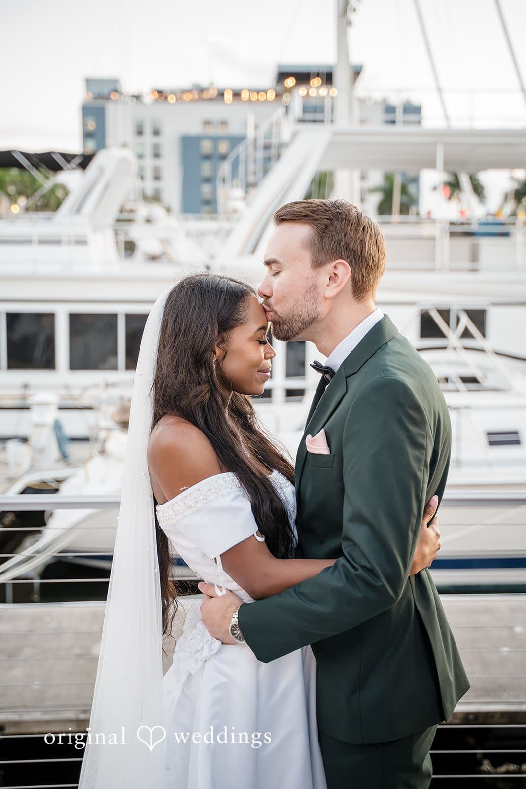 The couple share a romantic embrace.