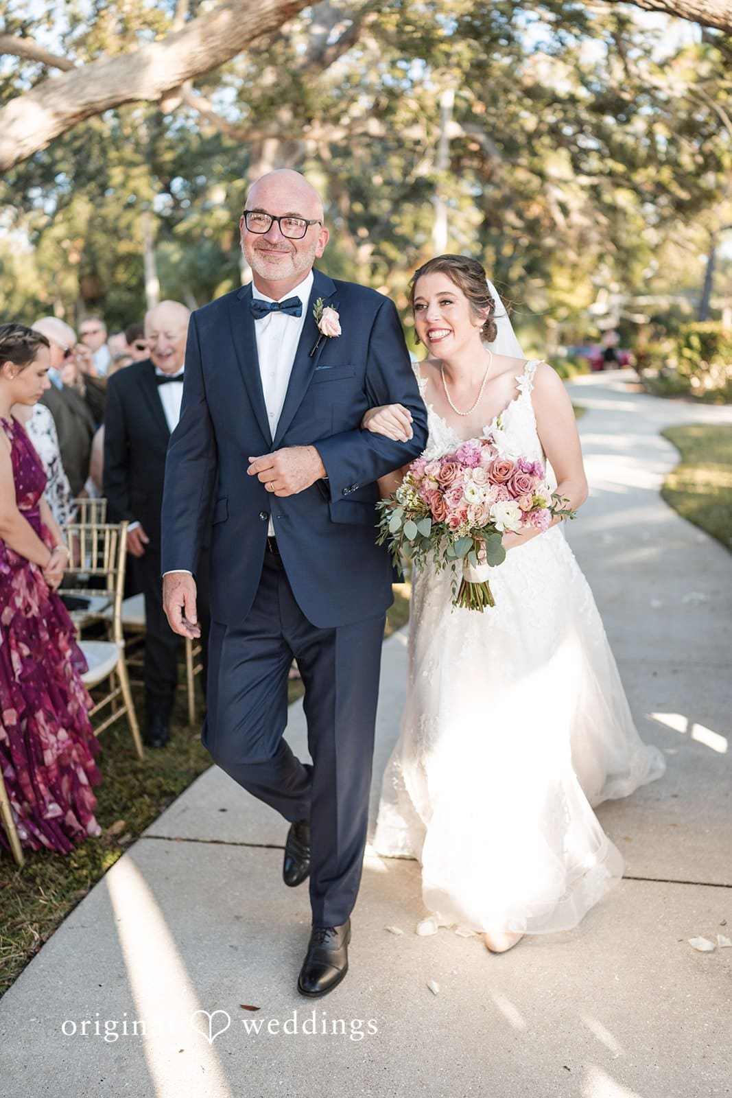 Nicole + Hunter Bride holding her father’s arm at Powel Crosley Estate