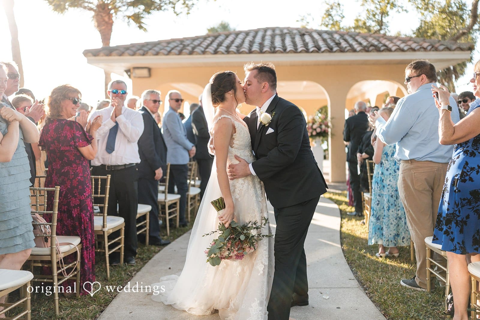 Nicole + Hunter Romantic wedding kiss of bride and groom