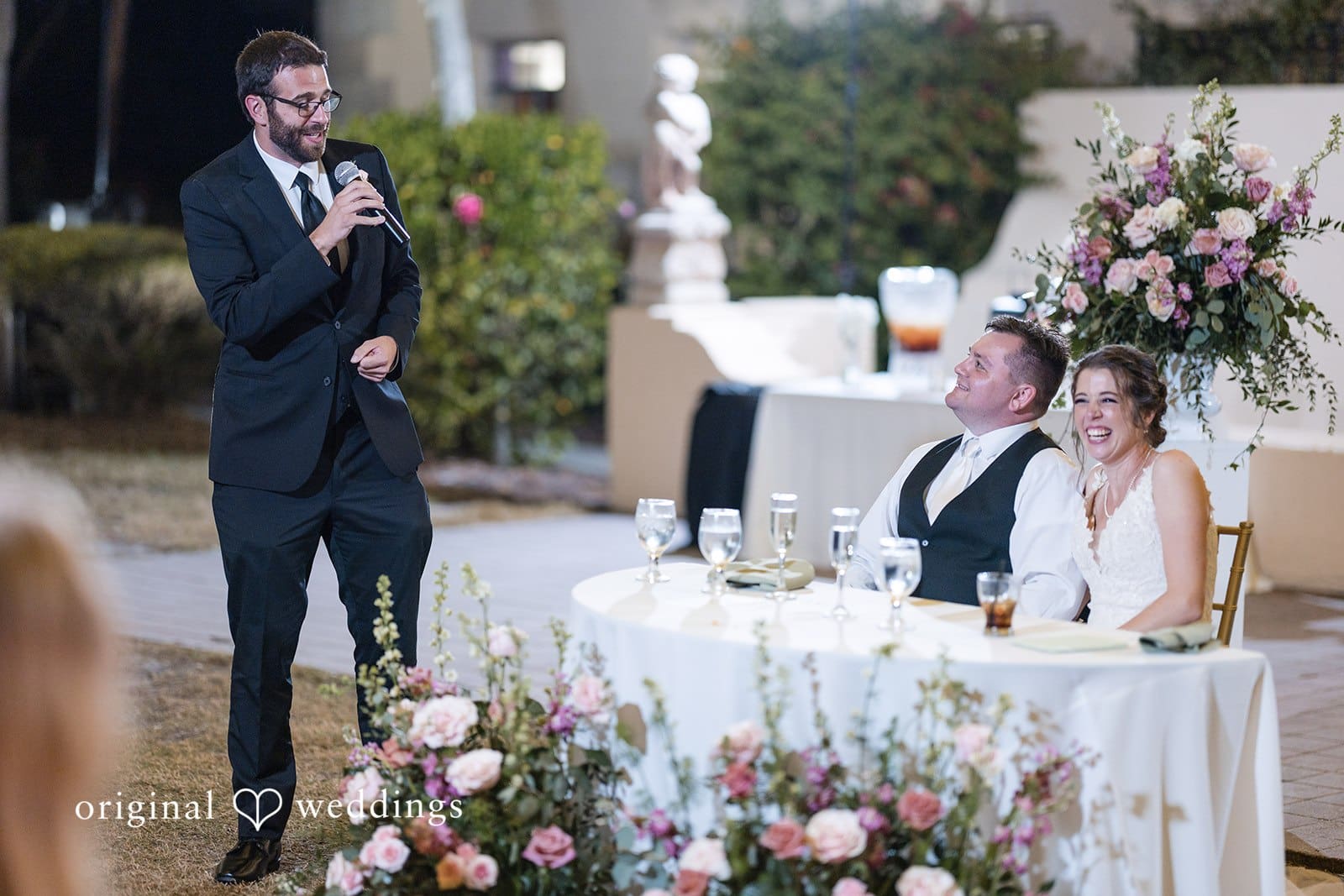 Nicole + Hunter DJ sing music at outdoor wedding reception