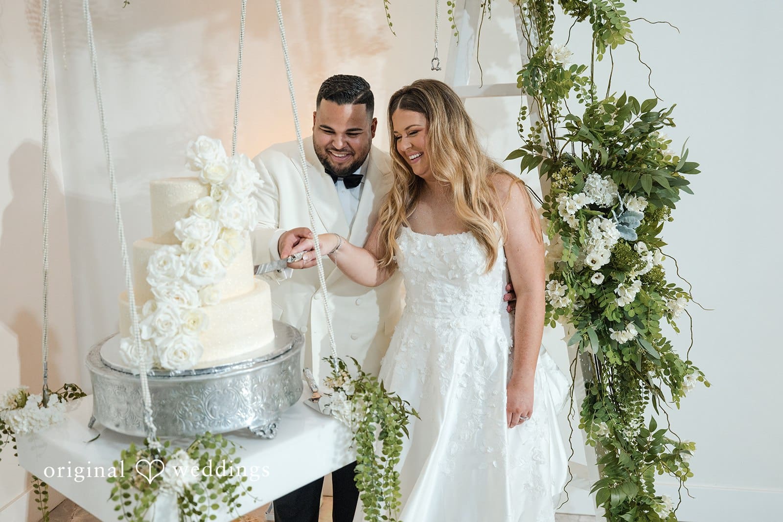 Our Miami wedding photographers captured the moment the couple joyfully cut their wedding cake