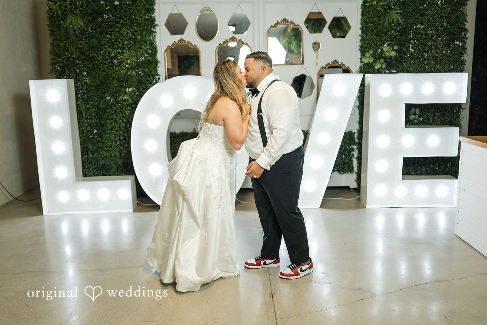 The couple shares a romantic kiss