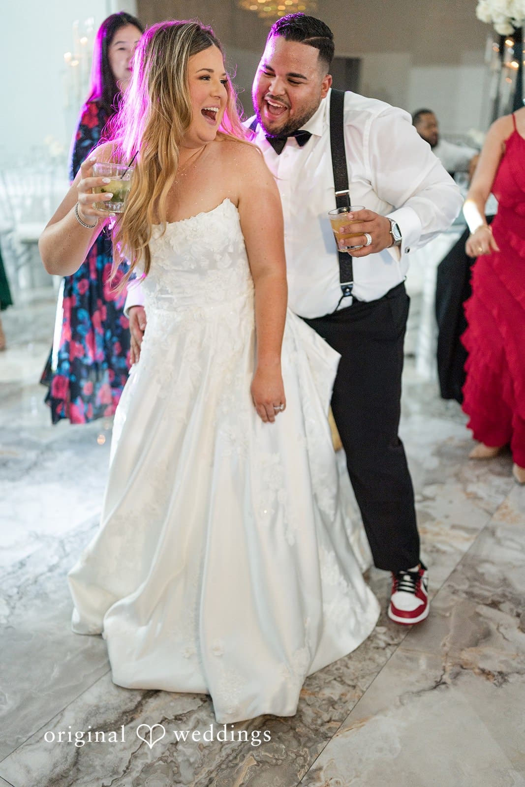 The couple dancing happily at their wedding reception