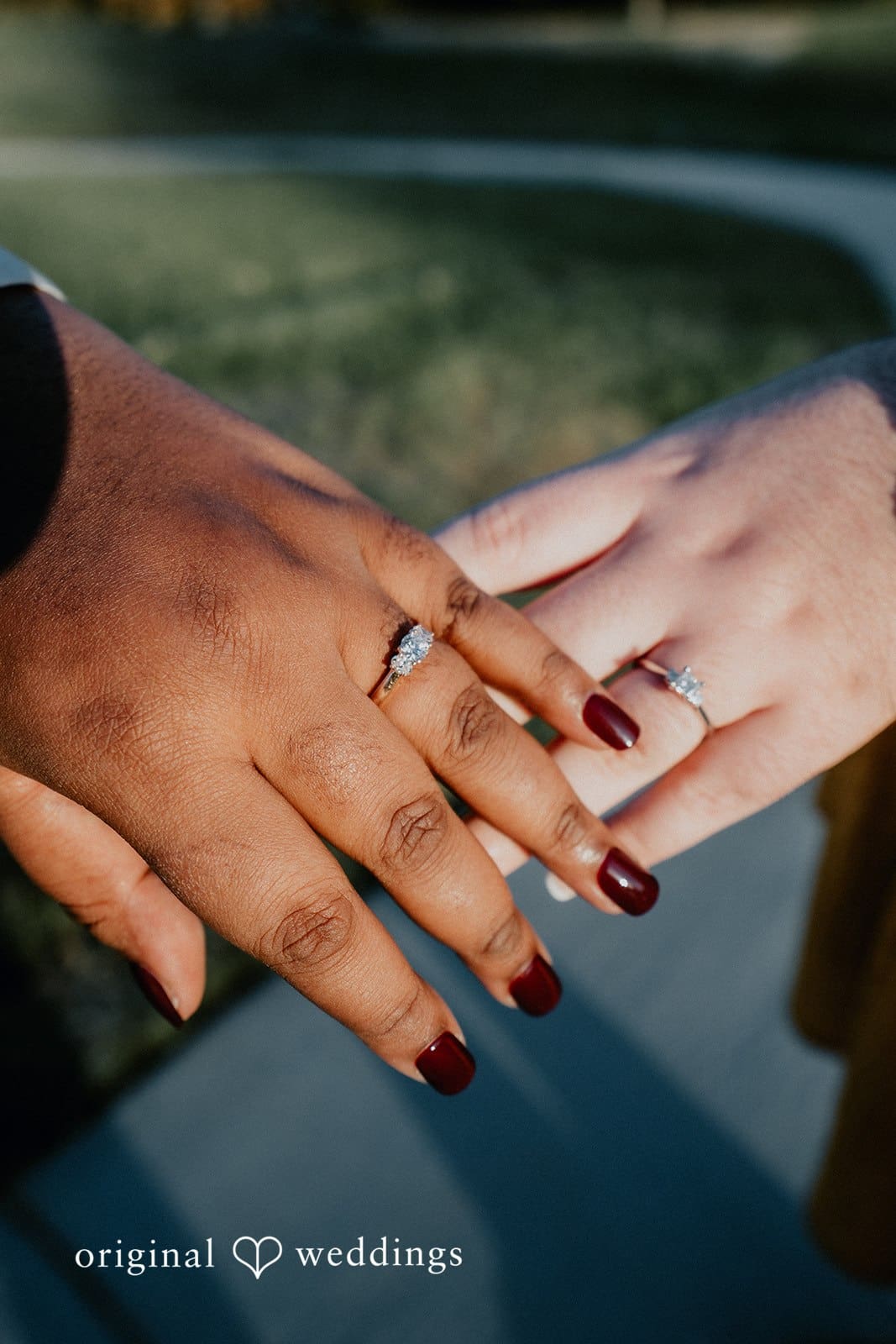 A close-up shot of the couple's engagement rings
