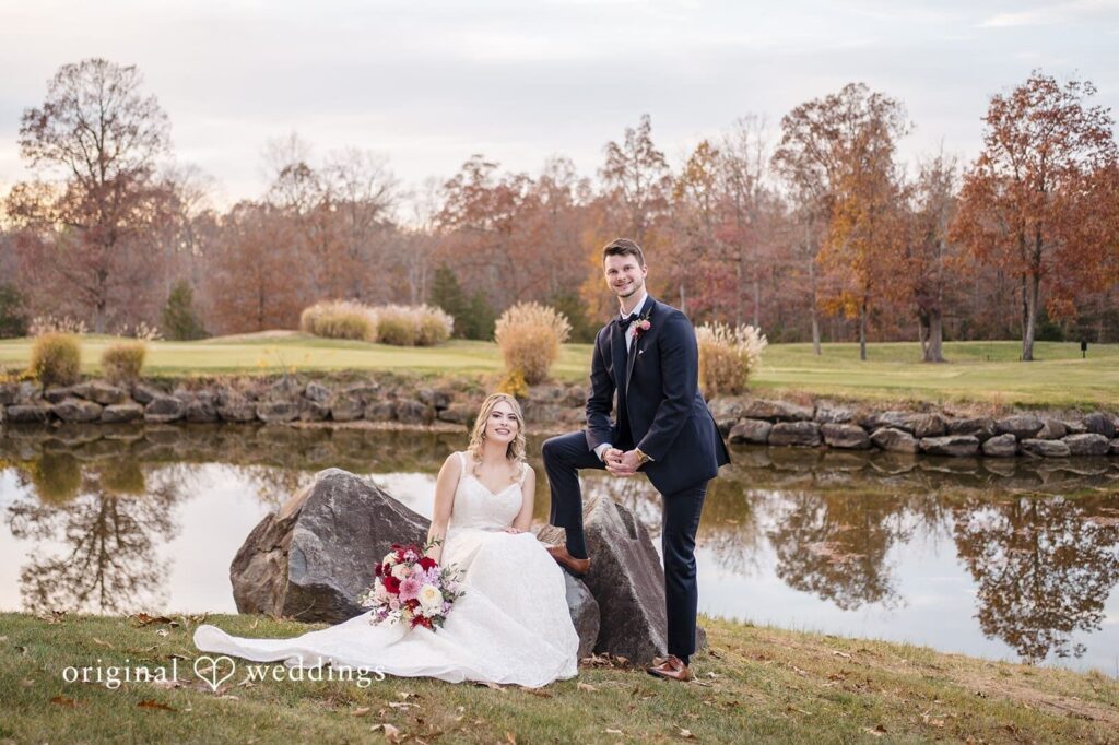 Our Washington DC wedding photographer at Original Weddings took a portrait of the couple by the golf course pond at Fairfax Country Club after their ceremony at Saint Mary of Sorrows Catholic Church