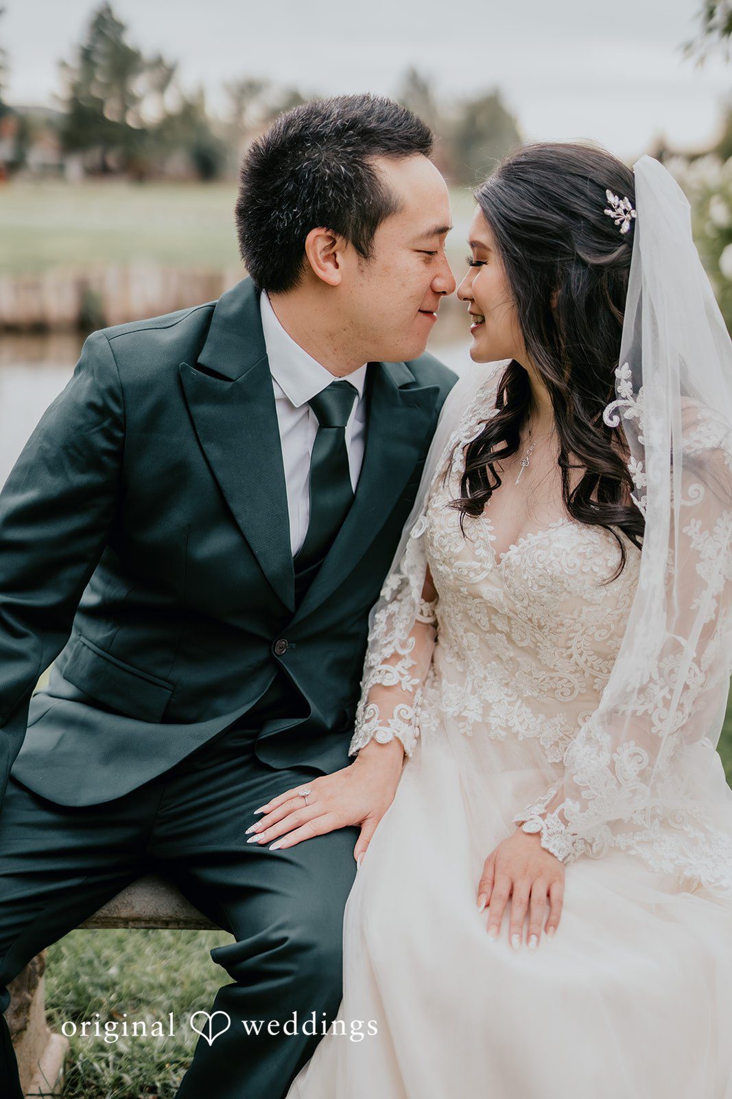 A romantic portrait of the couple at San Ramon Waters