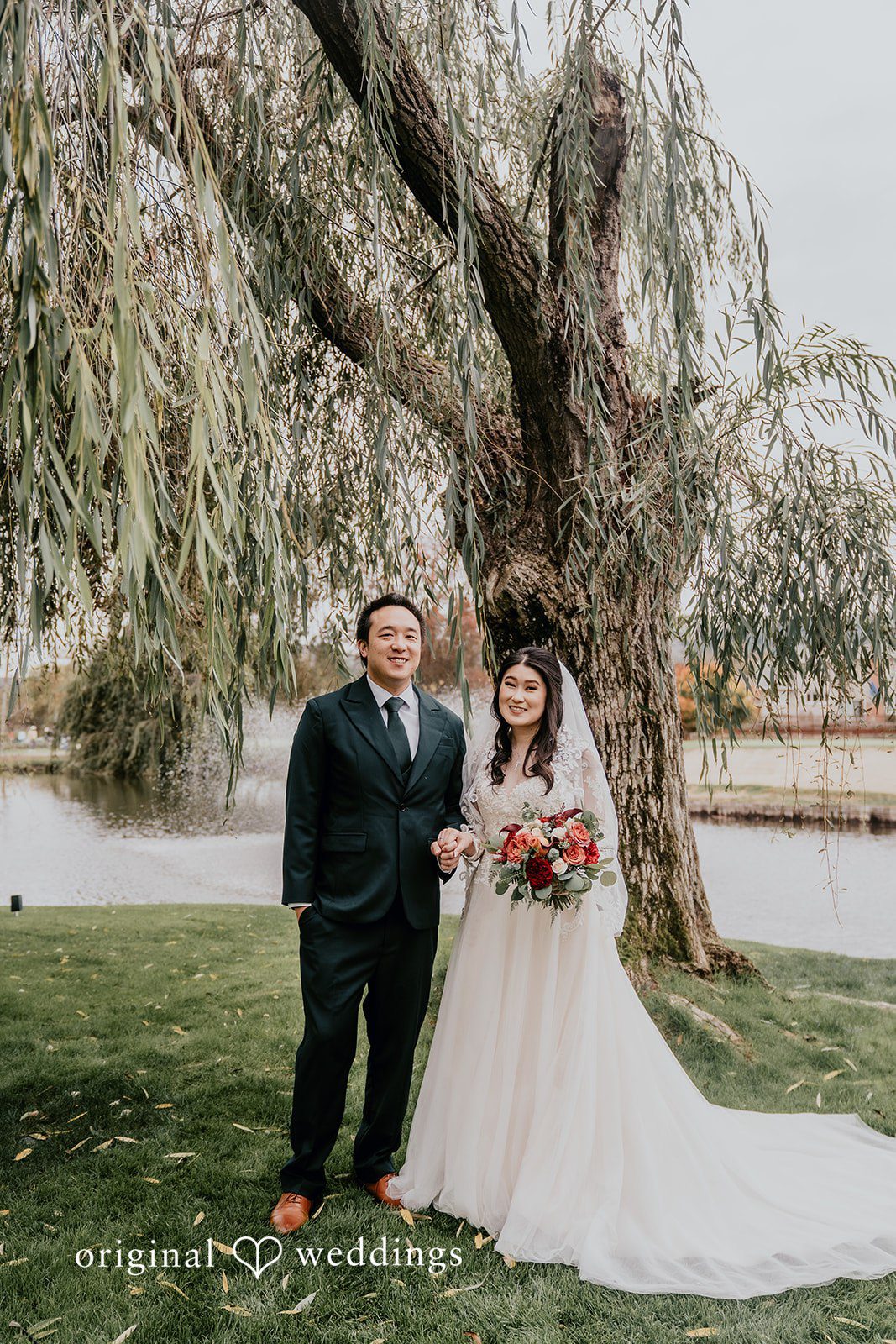 A portrait of the couple by the water