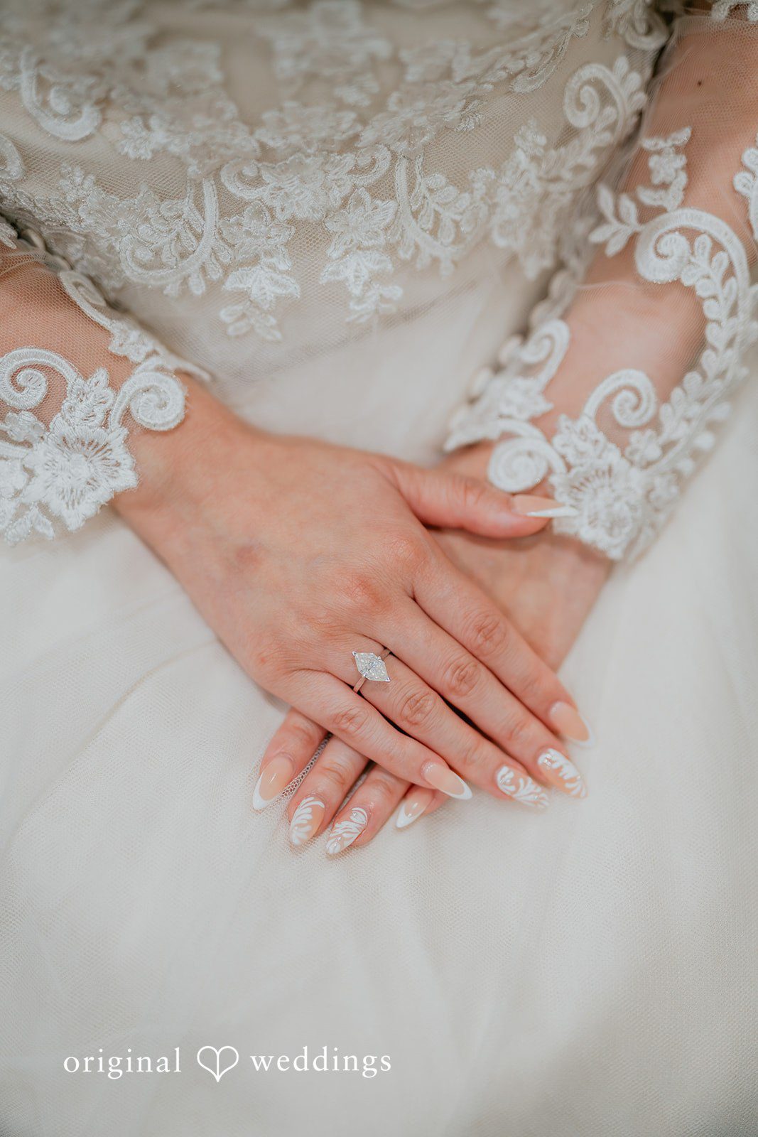 A close-up shot of the bride with her wedding ring on