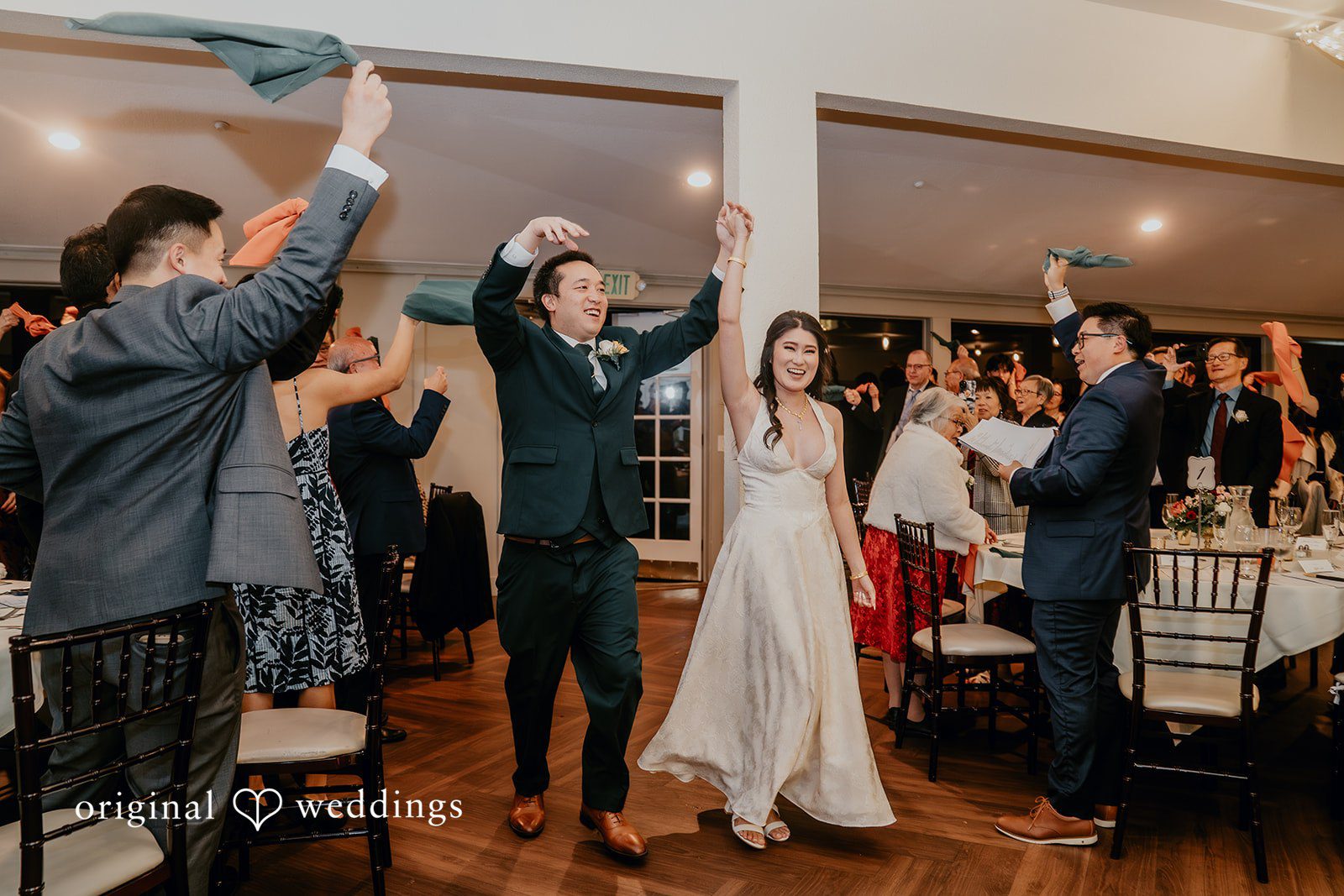 The couple’s joyful grand entrance to their wedding reception