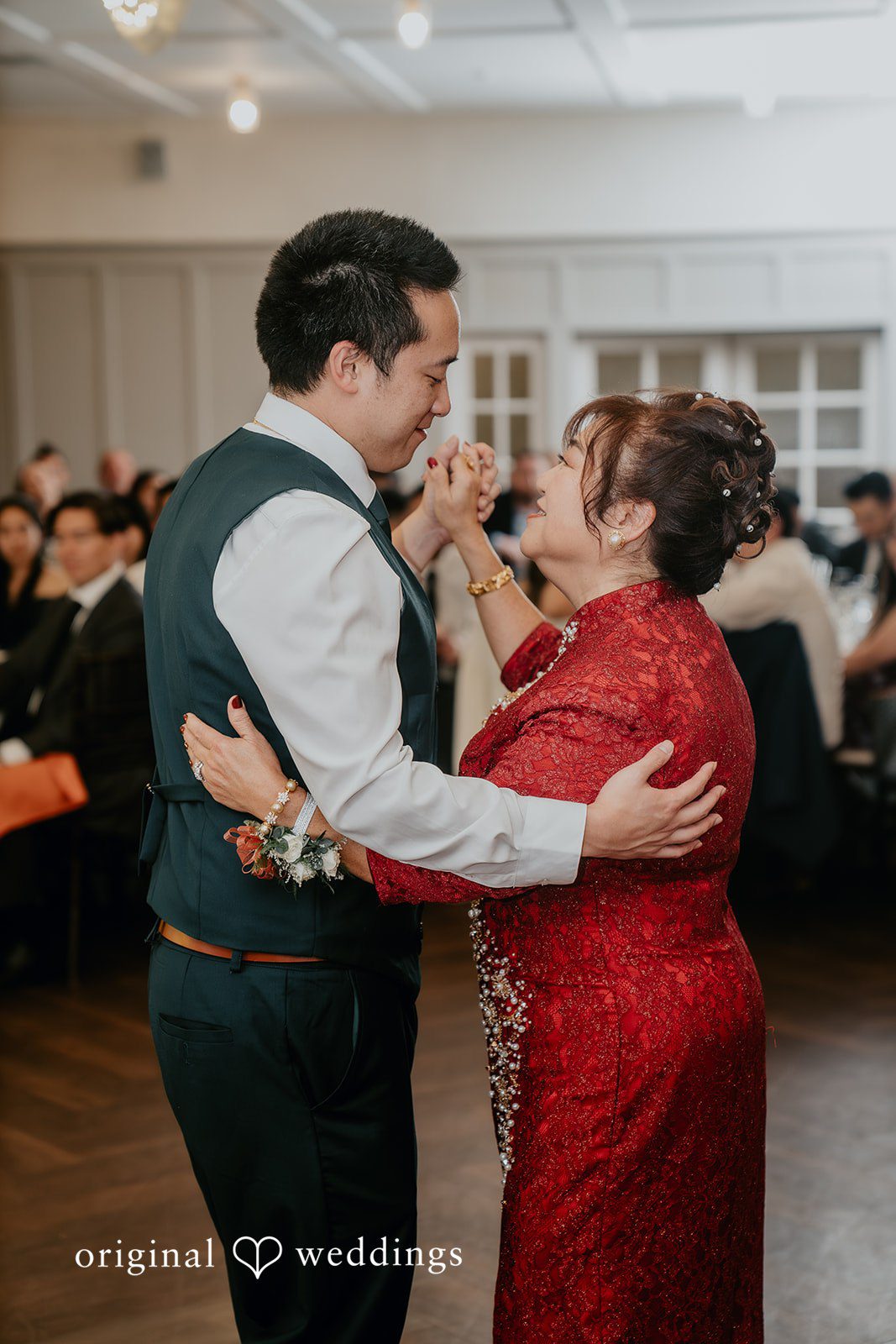 The groom dances with his mother