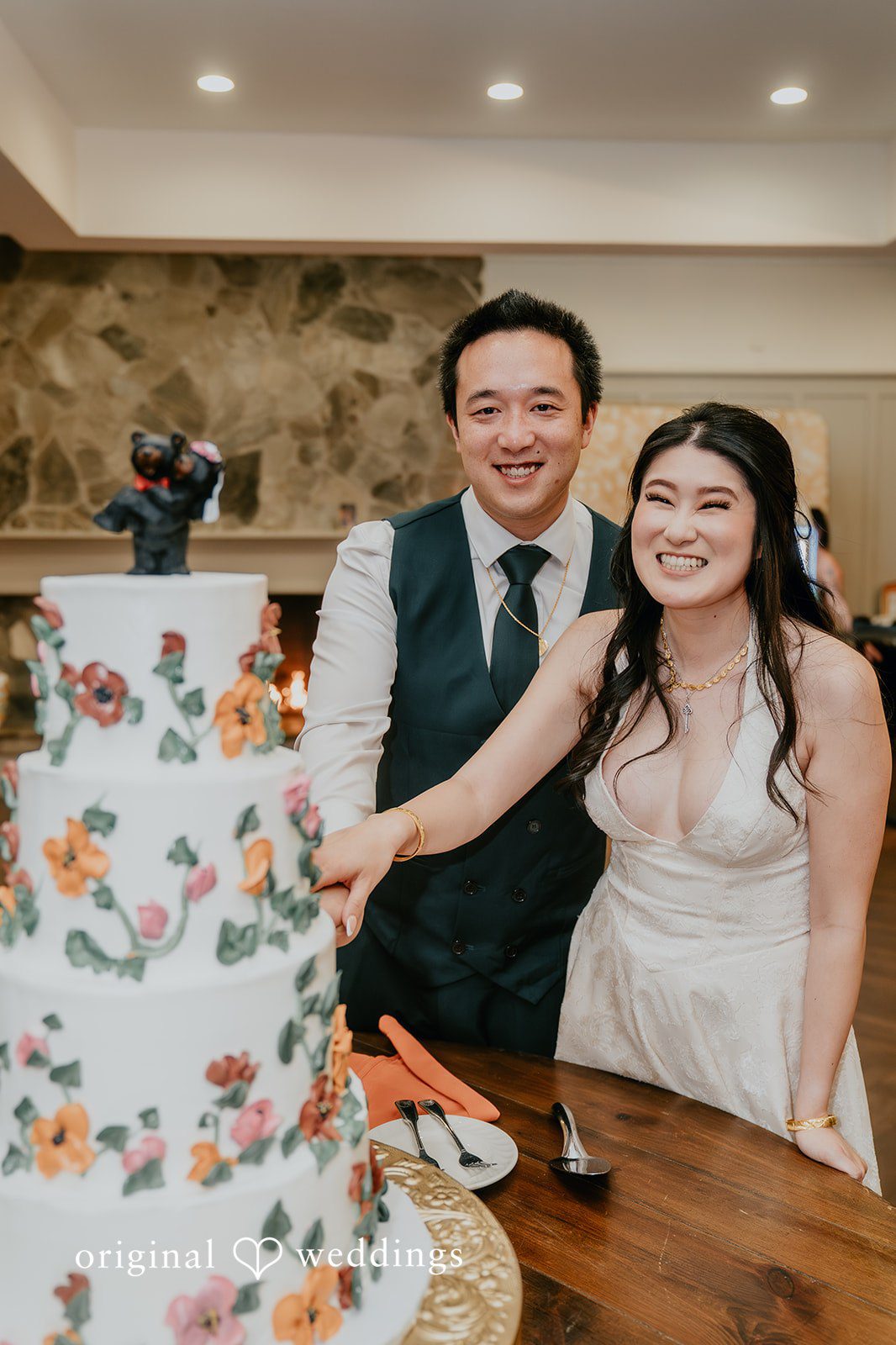 A heartfelt moment the couple cuts their wedding cake