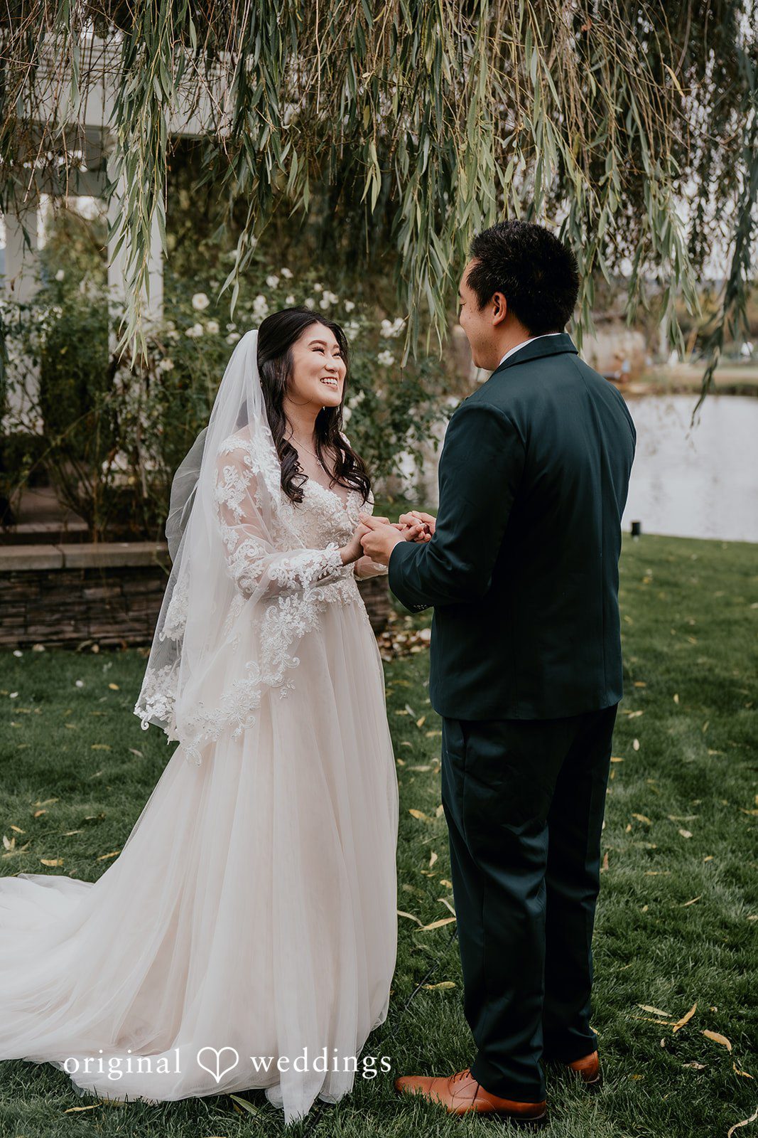 A beautiful portrait of the couple in the scenic outdoor area of San Ramon Waters