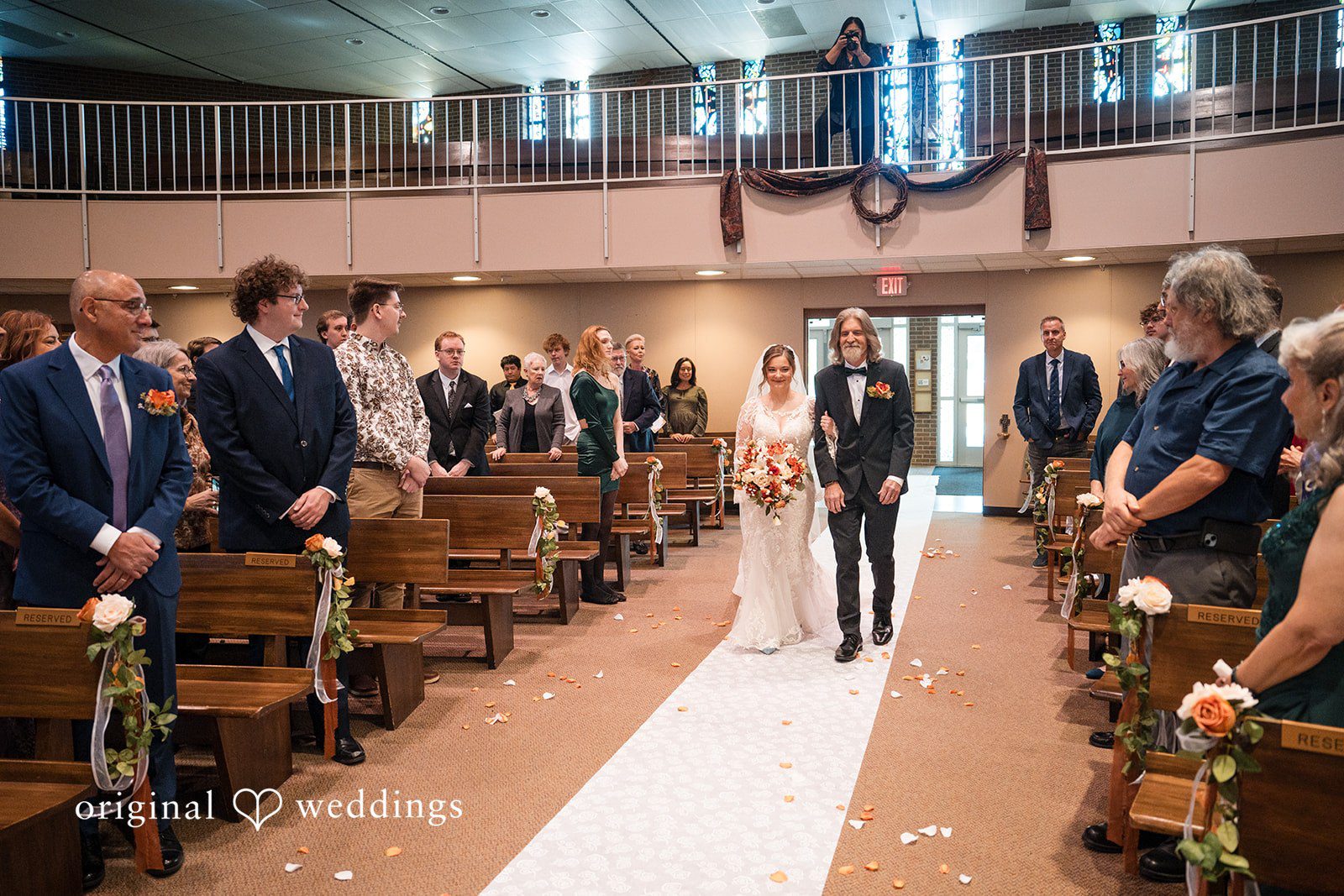 A heartfelt portrait of the bride's father, walking bride down the aisle