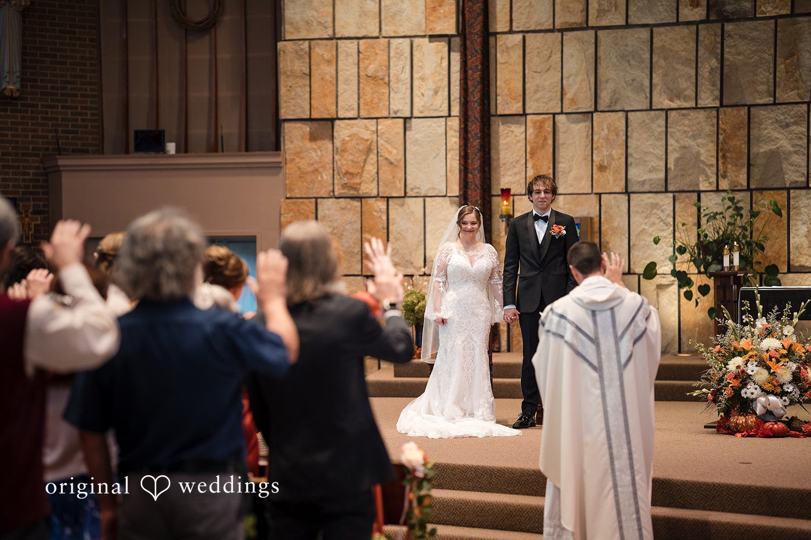 The priest blesses the couple’s union